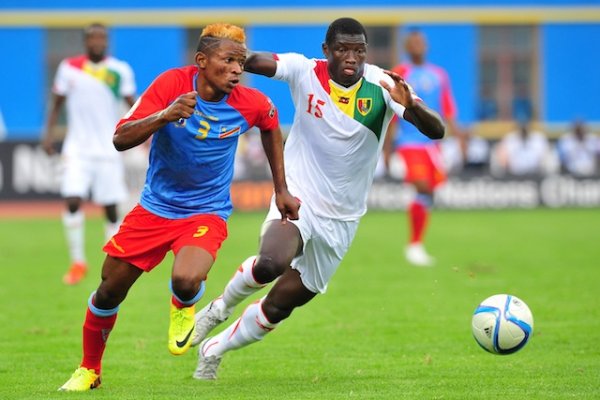 Lomalisa Mutambala of DR Congo is challenged by Alseny Camara of Guinea during the 2016 CHAN Rwanda semifinal game between DR Congo and Guinea at Amahoro Stadium, Kigali on 3 February 2016 ©Ryan Wilkisky/BackpagePix